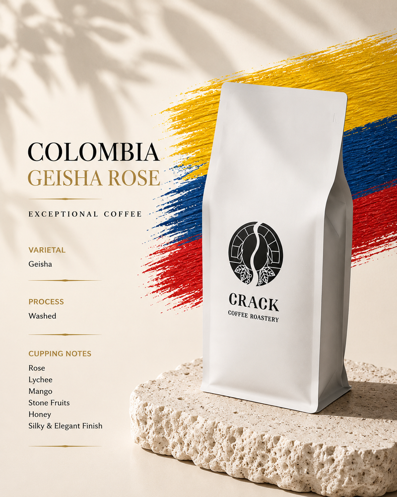 A white coffee bag labeled 'COLOMBIA GEISHA ROSE' and 'CRACK COFFEE ROASTRY' stands on a textured stone slab against a cream background with bold yellow, blue, and red brushstroke graphics and shadow overlays.
