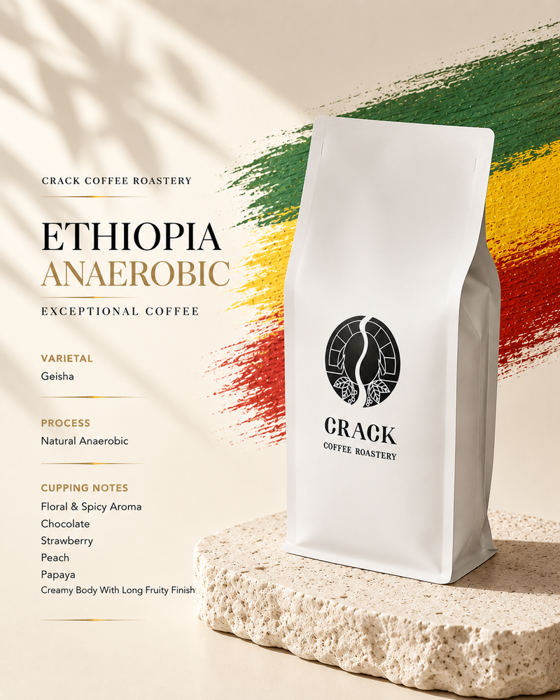 A white bag of Crack Coffee Roastery Ethiopia Anaerobic coffee stands on a textured stone slab against a warm beige background with green, yellow, and red brushstroke accents and product text on the left.